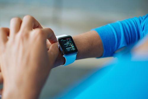 person operating smartwatch